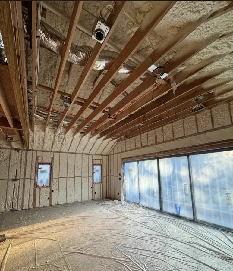 Interior walls and ceiling insulated with spray foam during new construction in Graham